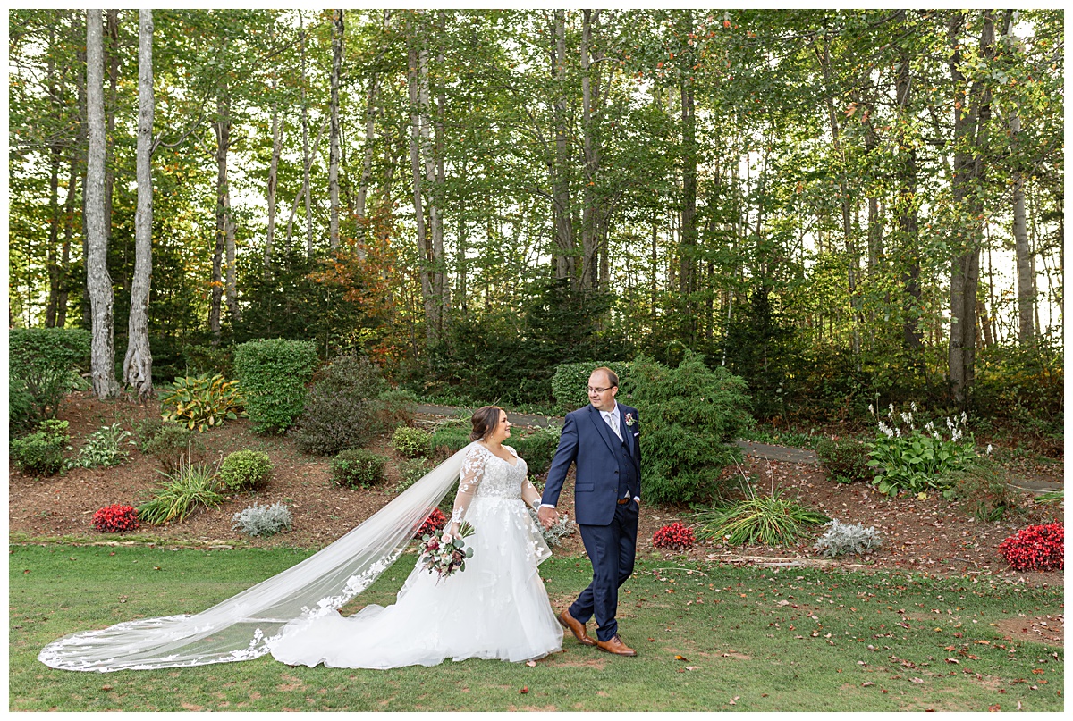 BRide and groom walking on the Mill River Resort Golf Course