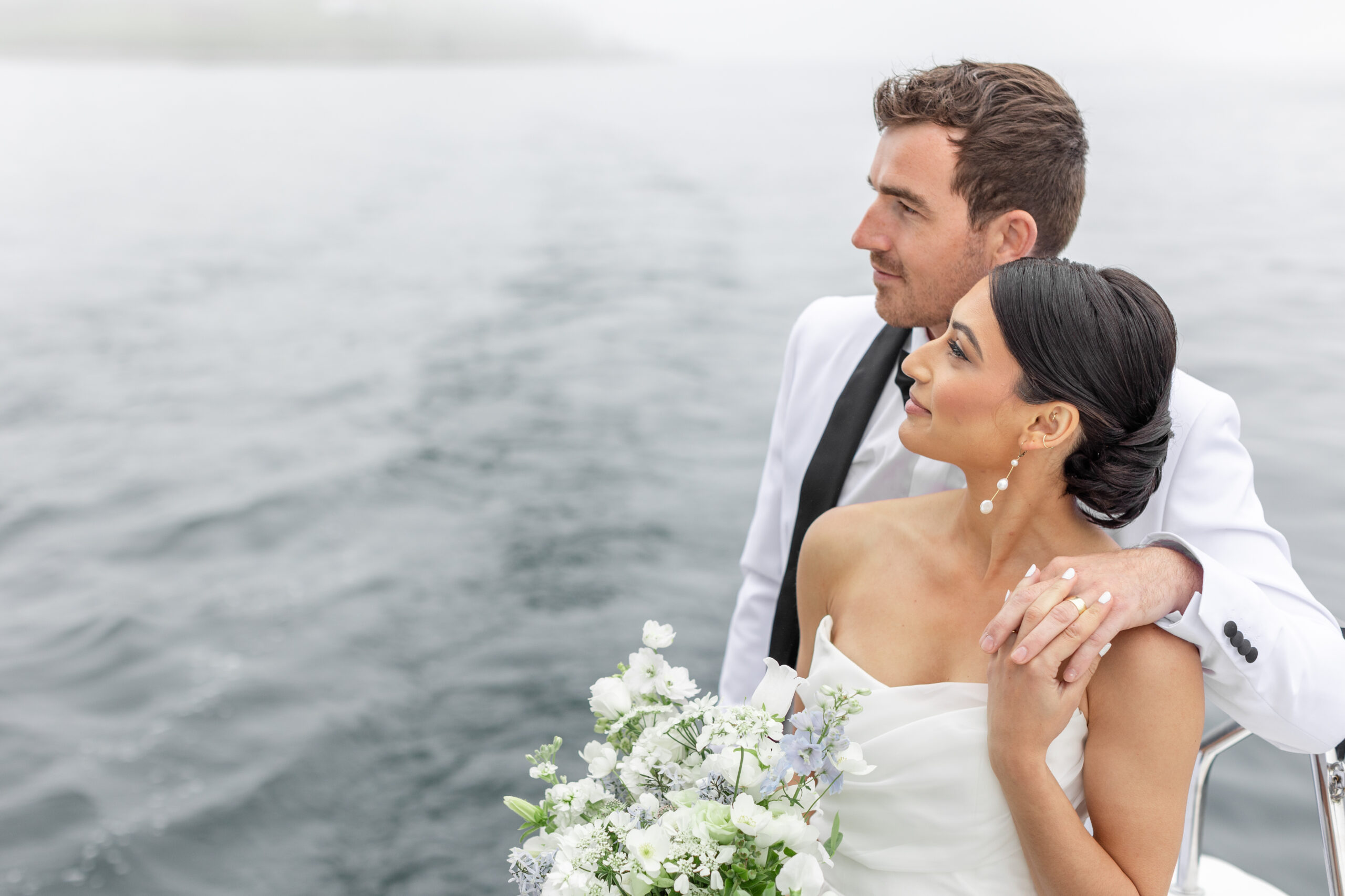 Couple posing for photos on catamaran in Halifax Harbour